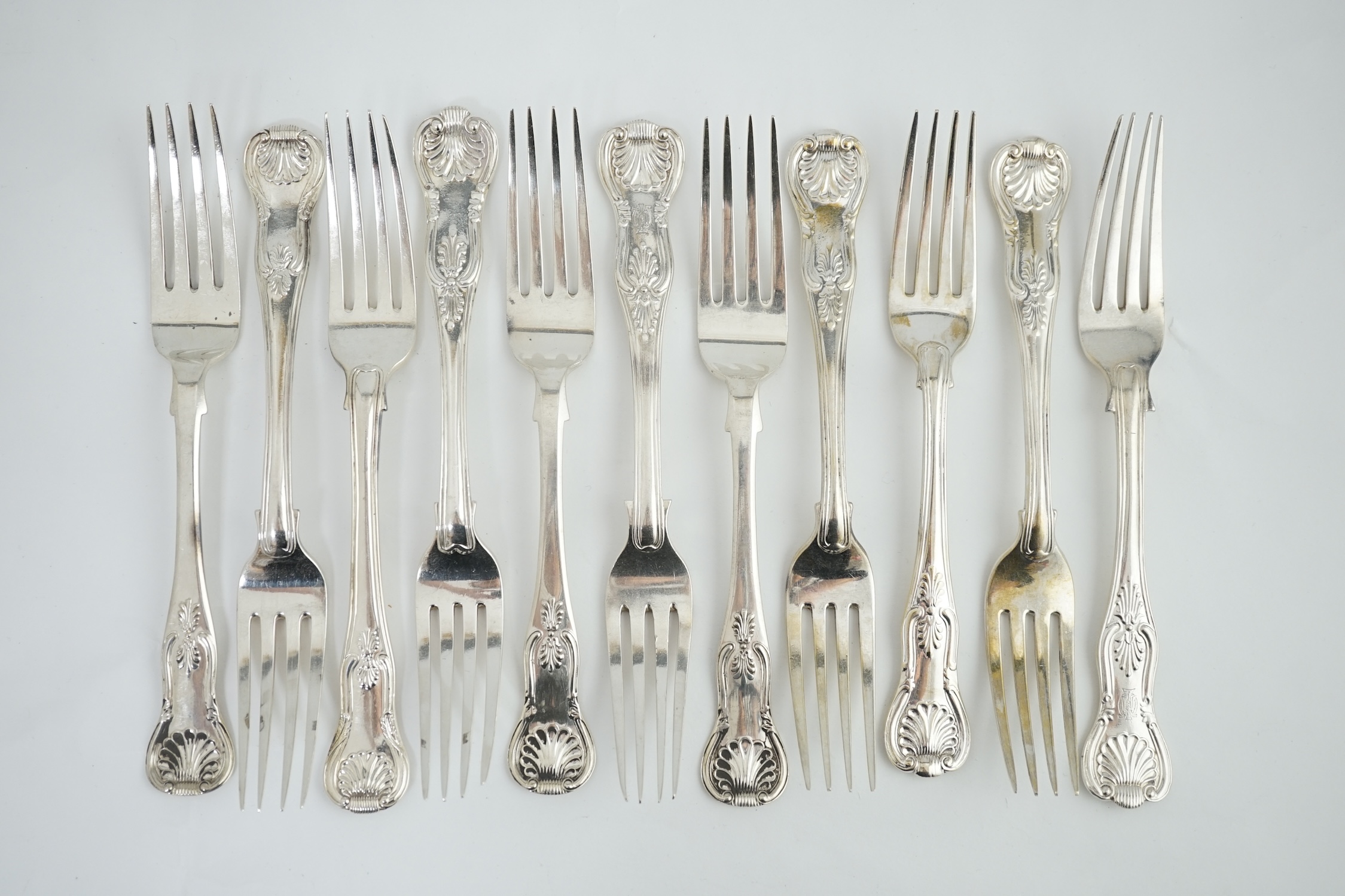 A harlequin set of eleven Georgian and Victorian silver Kings pattern table forks, various dates and makers, 32.8ozs.